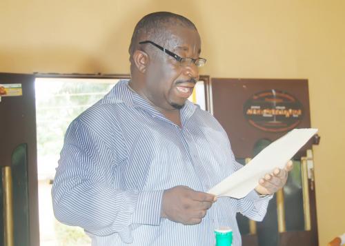 Engr. Ukachu the Patron of Ndiucheagwu community reading the letter of commendation of Master Chijioke Samuel Ukachu during the presentations.